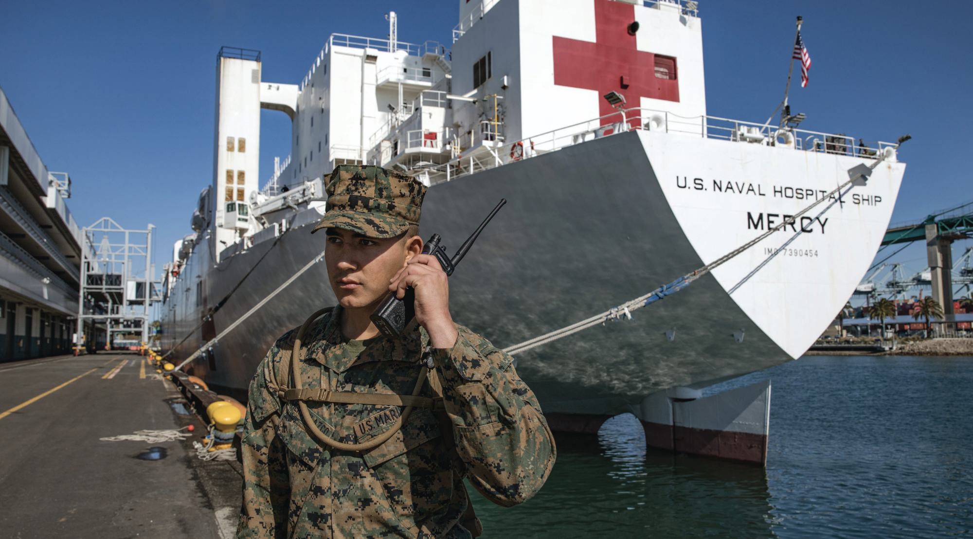 Marine Corps Private First Class Arnoldo RomeroVelazco, rifleman with 1st Battalion, 4th Marine Regiment, 1st Marine Division, posts security tosecure Military Sealift Command hospital ship USNS Mercy in Los Angeles, California, March 27, 2020, deployed in support of Nation’s COVID-19response efforts (U.S. Marine Corps/Alexa M. Hernandez)